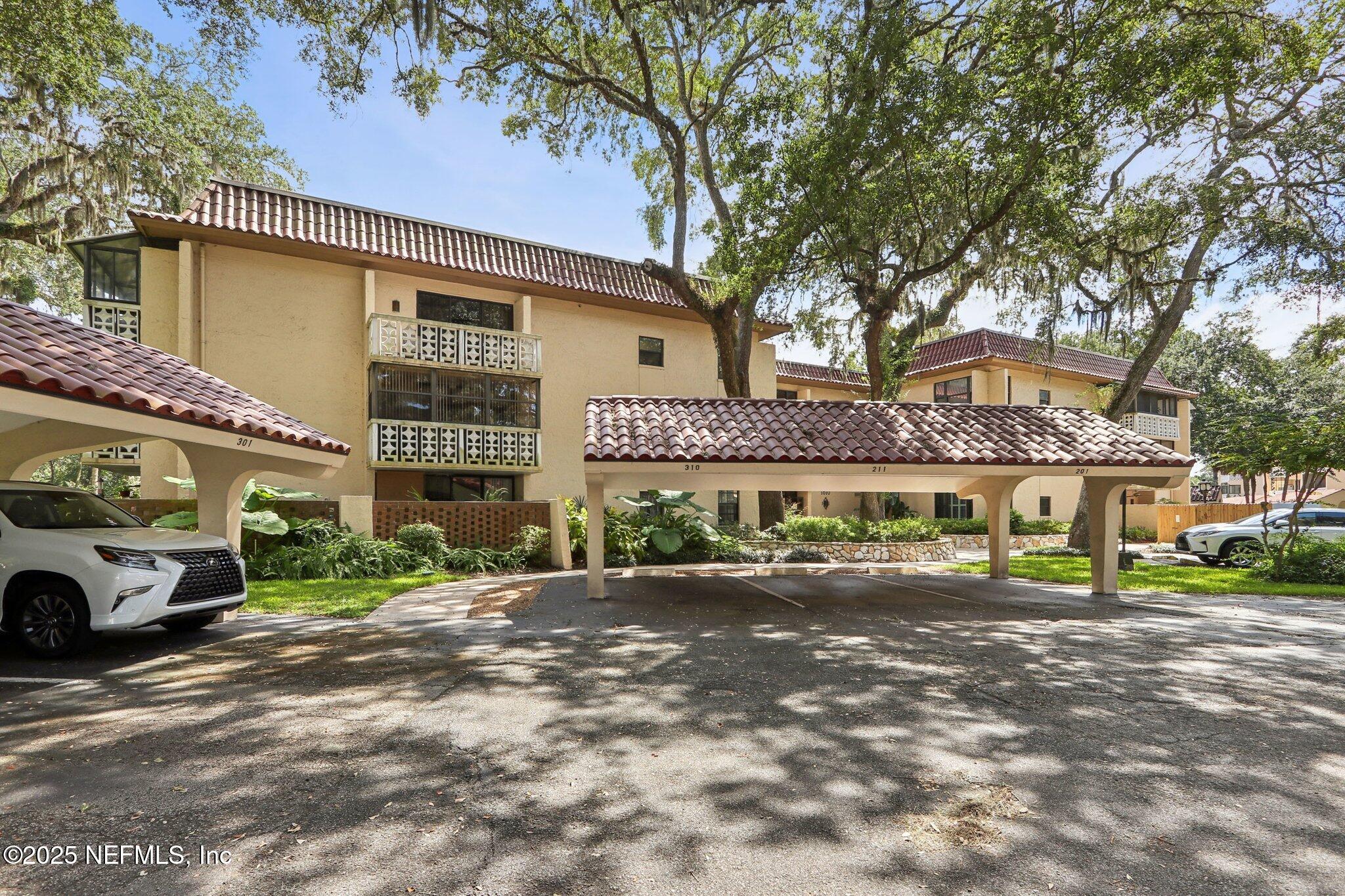 1810 Sevilla Boulevard West, Unit 307 Atlantic Beach, FL 32233 - Photo 27 of 28 a front view of a building with street view