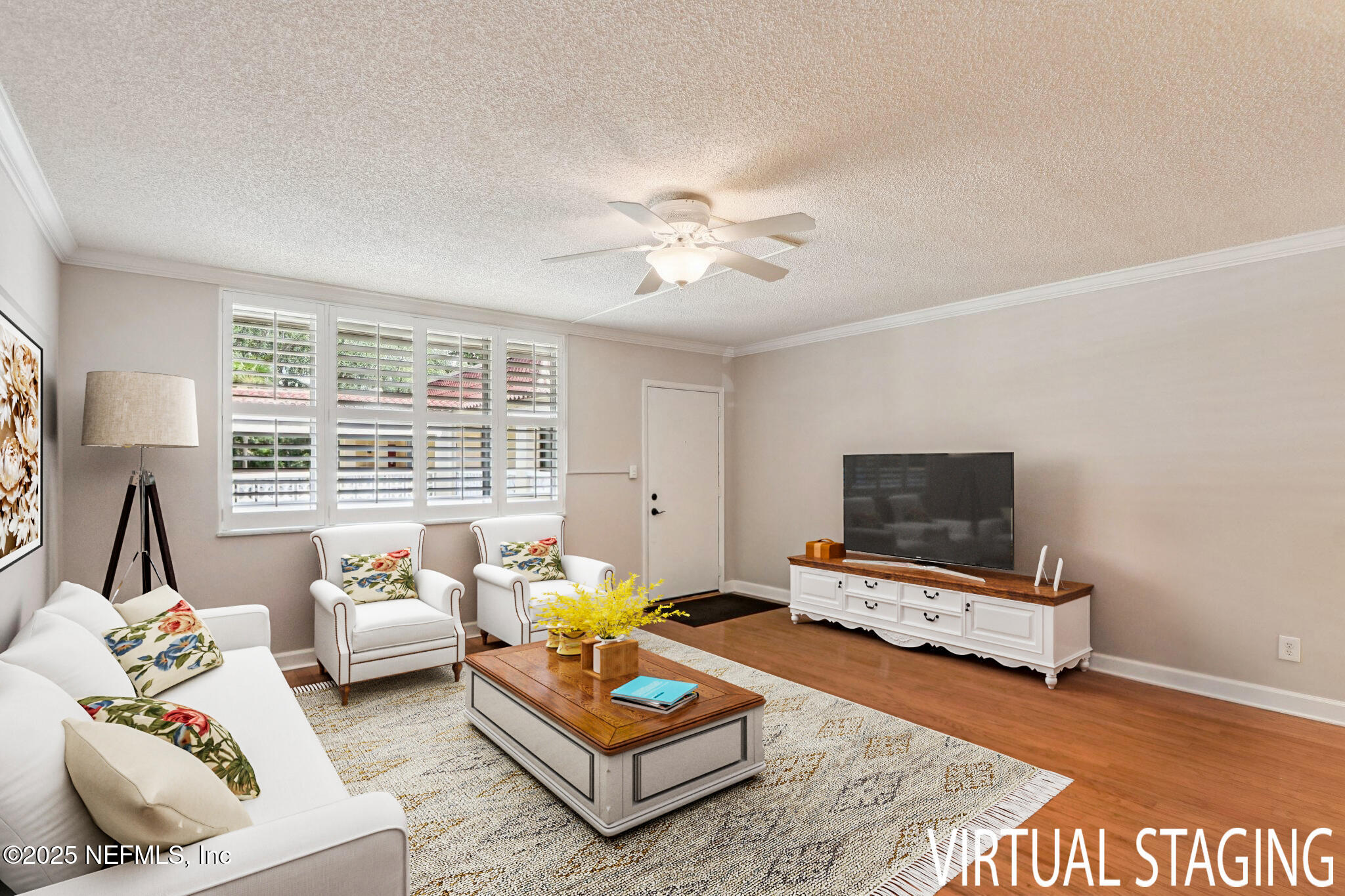 1810 Sevilla Boulevard West, Unit 307 Atlantic Beach, FL 32233 - Photo 5 of 28 a living room with furniture a rug and a flat screen tv