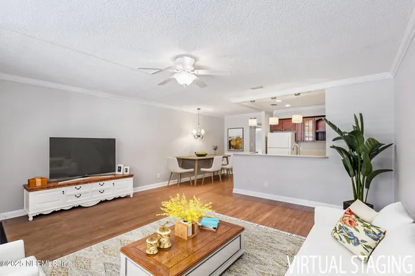 a kitchen with a sink cabinets and wooden floor