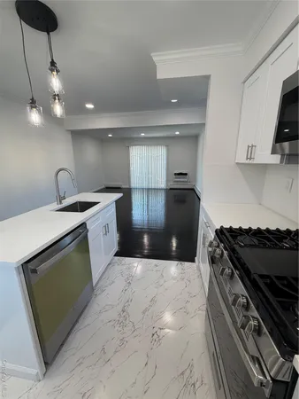 a kitchen with a stove and a refrigerator