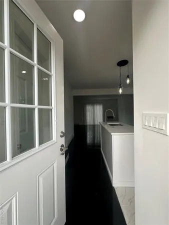 a kitchen with a refrigerator and a sink