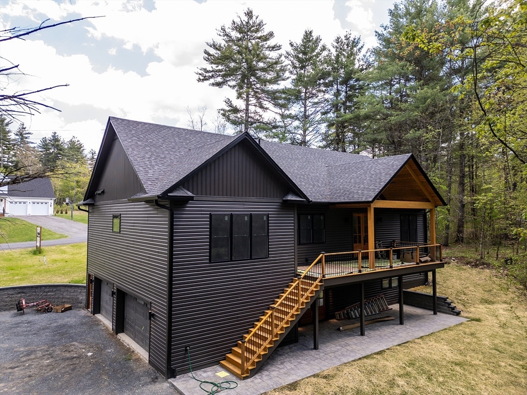 20 Merrifield Road North Bernardston, MA 01337 - Photo 6 of 17 a front view of a house with a yard table and chairs