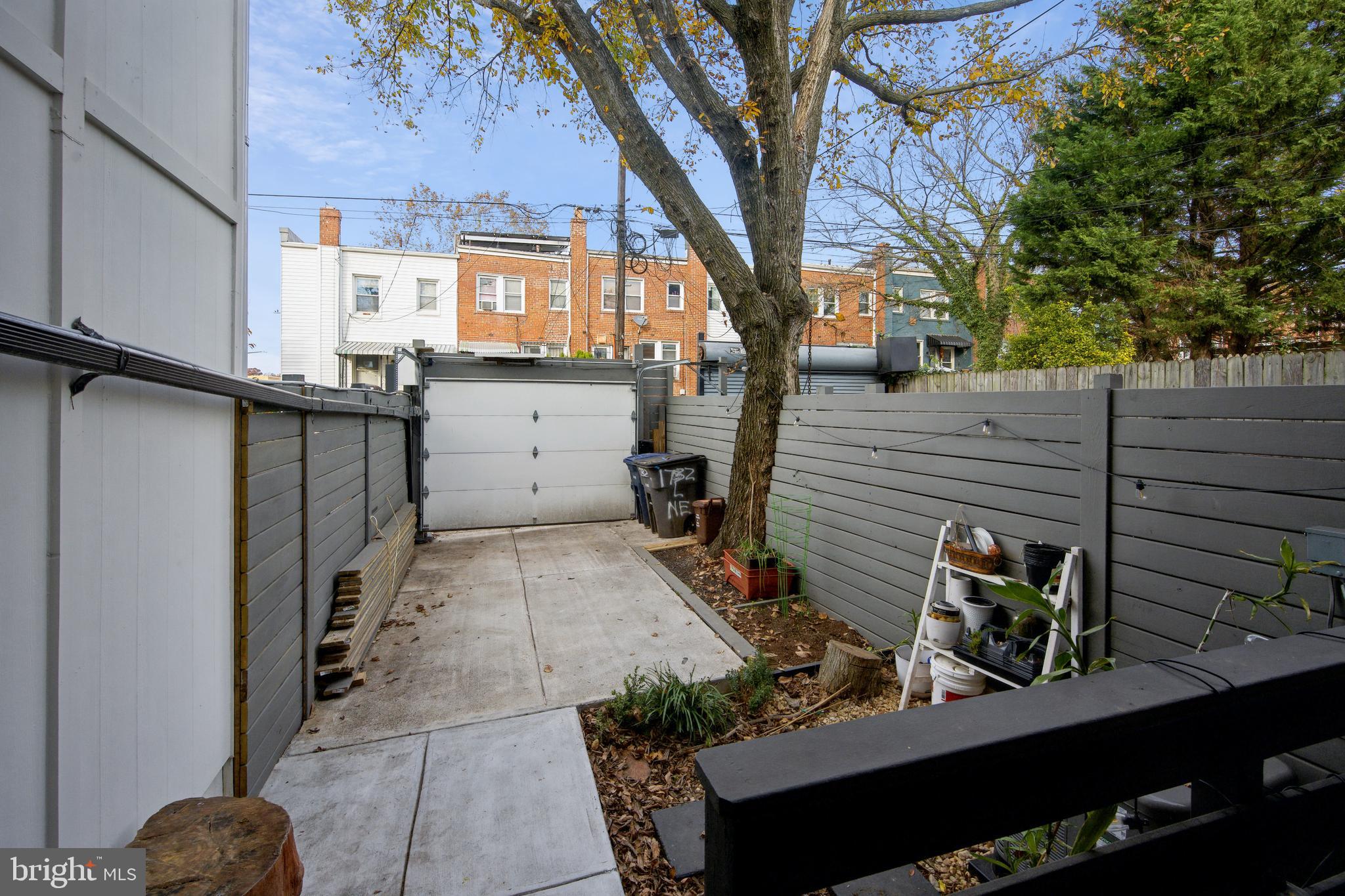 1732 L Street Northeast Washington, DC 20002 - Photo 19 of 20 a view of a house with a large tree