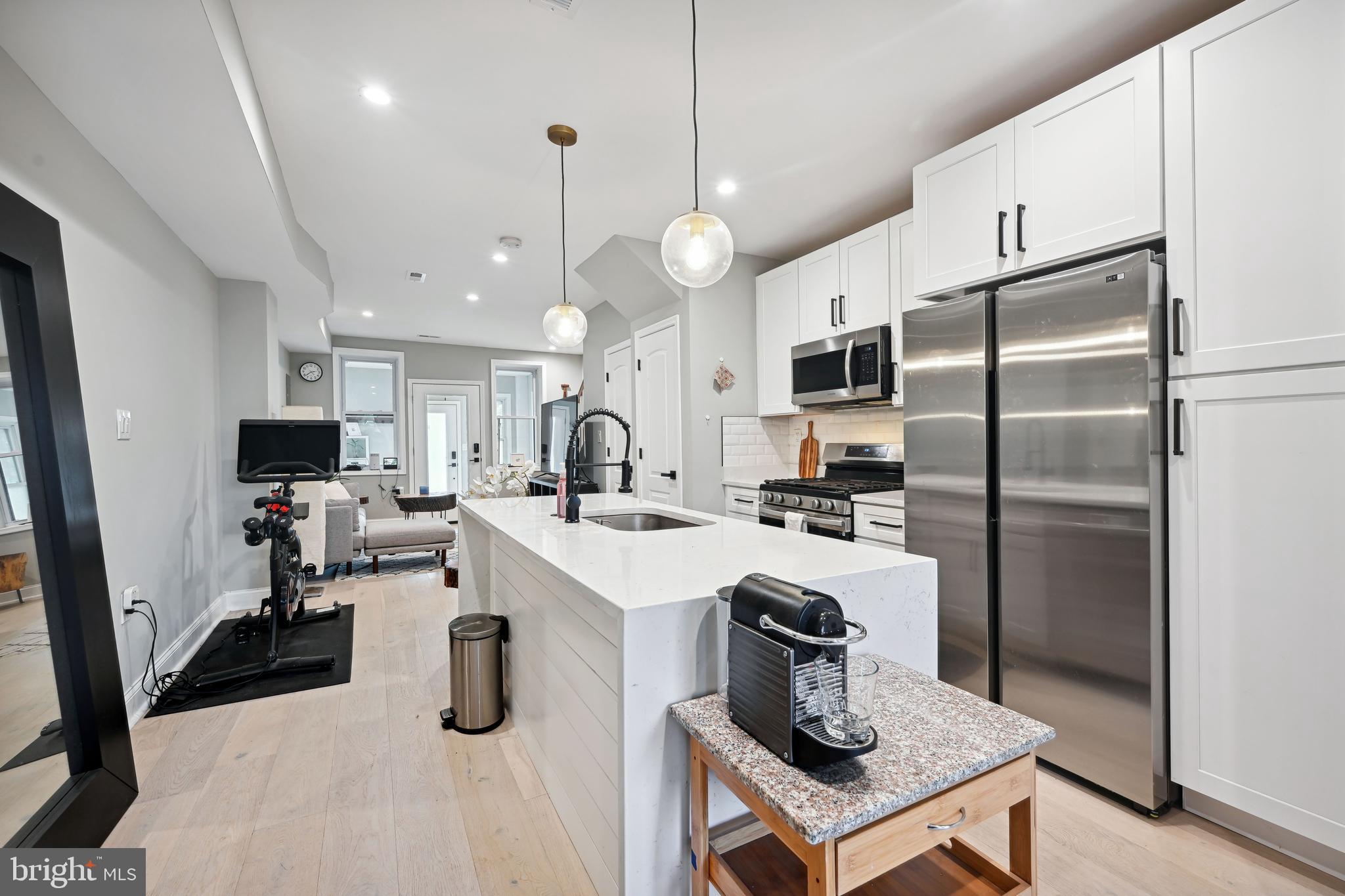 1732 L Street Northeast Washington, DC 20002 - Photo 20 of 20 a kitchen with sink a refrigerator and a stove top oven
