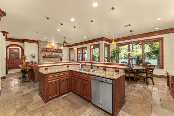 a kitchen with a sink and stove