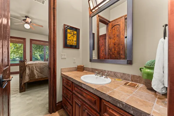 a en suite bathroom with a sink and a mirror