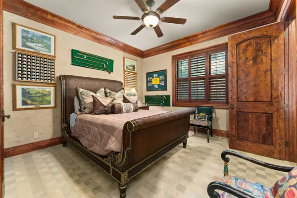 a bedroom with a bed dresser and a window