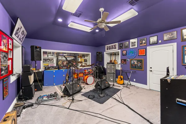 a view of a porch with furniture and a gate
