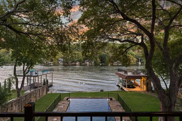 a front view of a house with a yard table and chairs