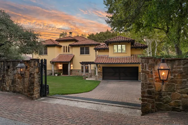 a front view of a house with yard
