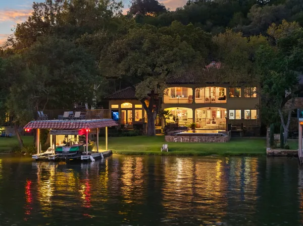 a view of a balcony with two chairs and a table