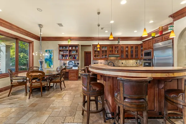 a open kitchen with a table and chairs in it