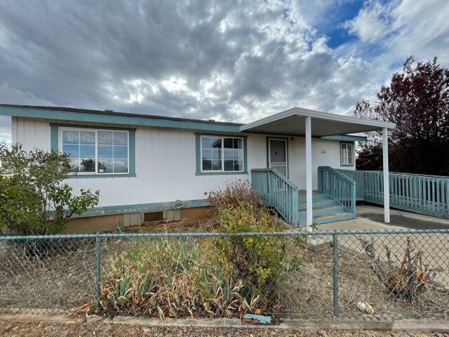 20875 Live Oak Road Red Bluff, CA 96080 - Photo 1 of 19 front view of a house with a yard