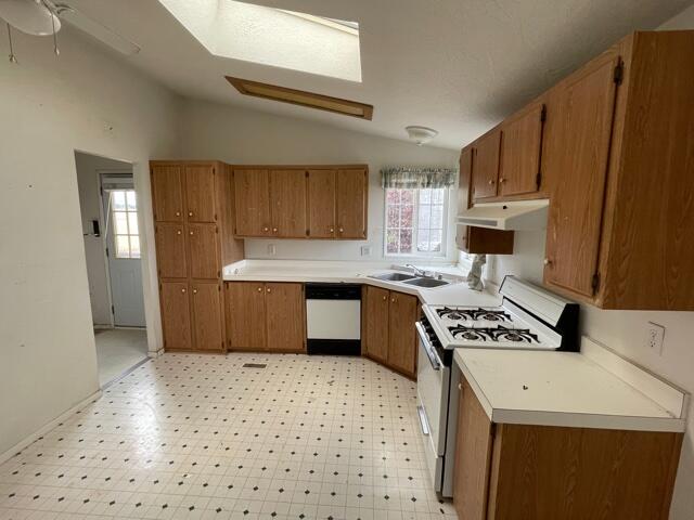 20875 Live Oak Road Red Bluff, CA 96080 - Photo 5 of 19 a kitchen with stainless steel appliances a sink a stove a refrigerator cabinets and a window