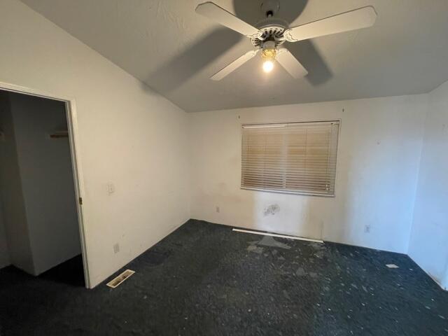 20875 Live Oak Road Red Bluff, CA 96080 - Photo 6 of 19 an empty room with a fan & a window