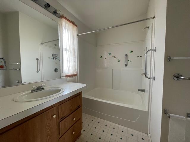 20875 Live Oak Road Red Bluff, CA 96080 - Photo 7 of 19 a bathroom with a granite countertop sink a mirror a shower and a bathtub
