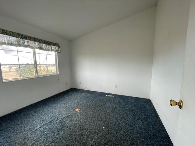 20875 Live Oak Road Red Bluff, CA 96080 - Photo 8 of 19 an empty room with a window