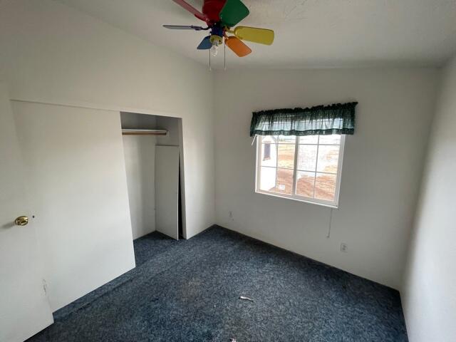 20875 Live Oak Road Red Bluff, CA 96080 - Photo 9 of 19 an empty room with windows and fan