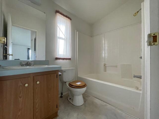 20875 Live Oak Road Red Bluff, CA 96080 - Photo 10 of 19 a bathroom with a granite countertop toilet a sink and a bathtub