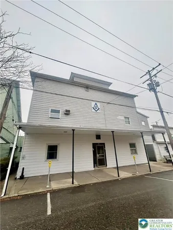 a view of a front of house with a street
