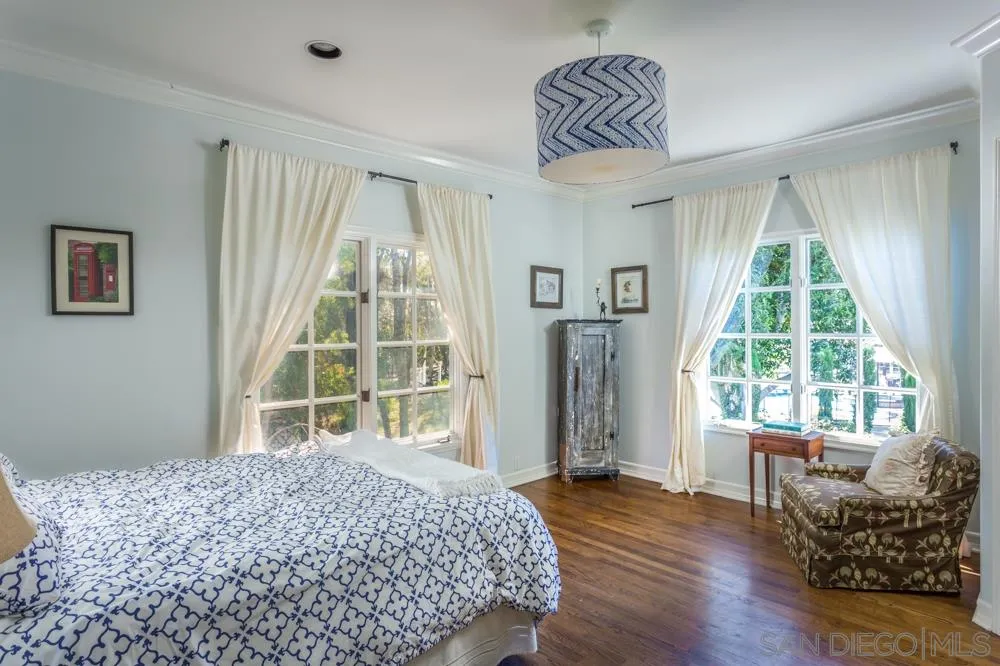 6645 Via Dos Valles Rancho Santa Fe, CA 92067 - Photo 16 of 20 a bedroom with a bed and wooden floor