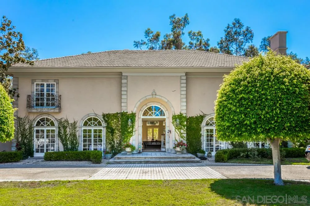 6645 Via Dos Valles Rancho Santa Fe, CA 92067 - Photo 2 of 20 a front view of a house with garden