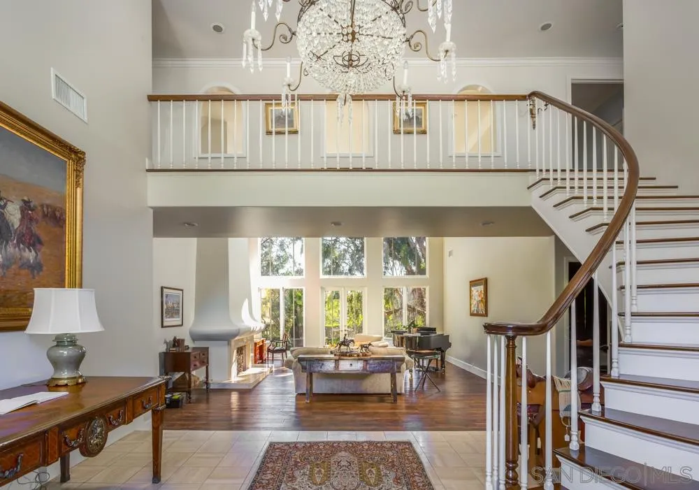 6645 Via Dos Valles Rancho Santa Fe, CA 92067 - Photo 3 of 20 a living room with furniture and a chandelier