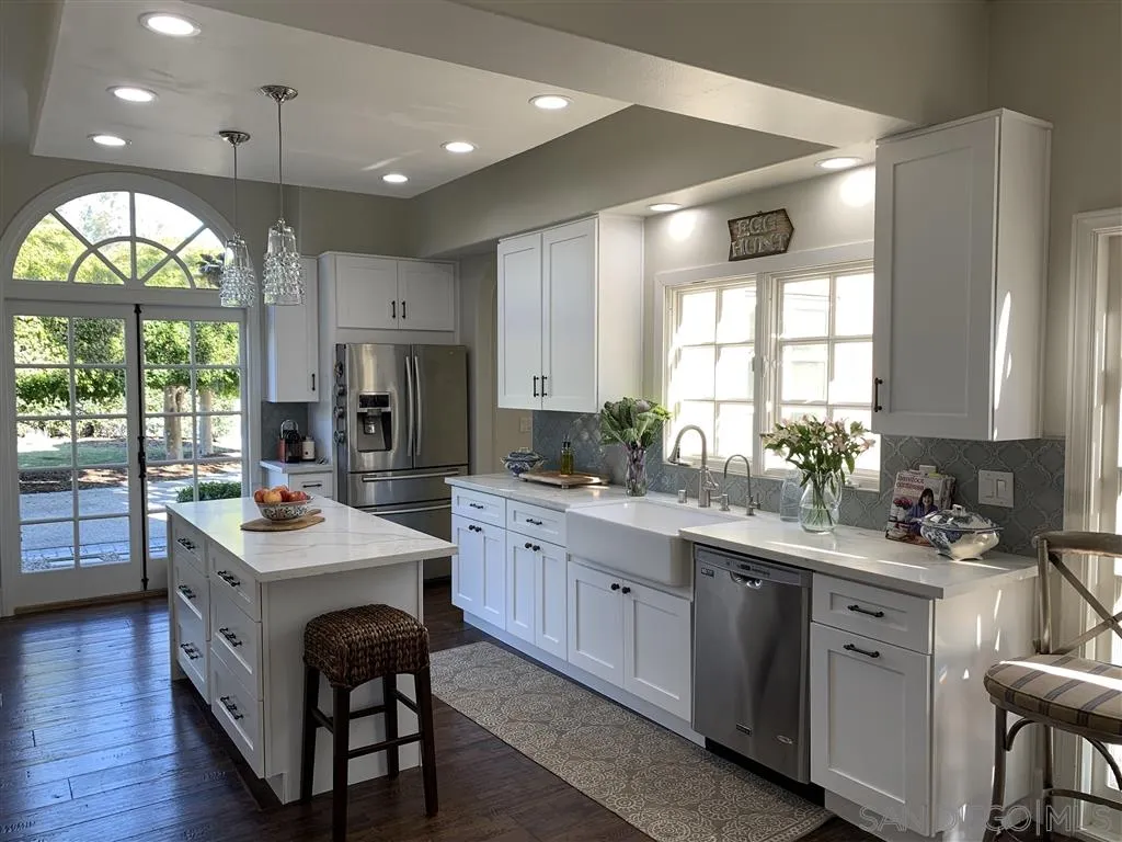 6645 Via Dos Valles Rancho Santa Fe, CA 92067 - Photo 5 of 20 a kitchen with a sink stove and cabinets