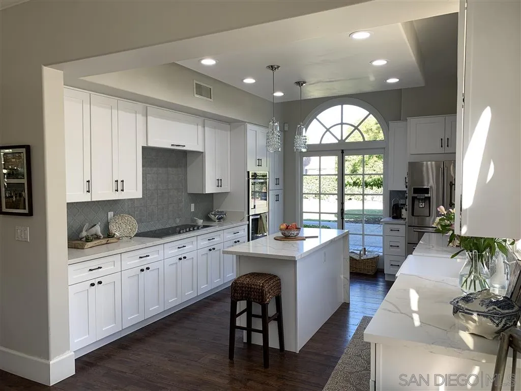 6645 Via Dos Valles Rancho Santa Fe, CA 92067 - Photo 6 of 20 an open kitchen with sink and cabinets