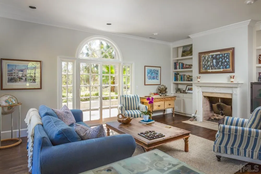 6645 Via Dos Valles Rancho Santa Fe, CA 92067 - Photo 10 of 20 a living room with furniture a fireplace and a large window