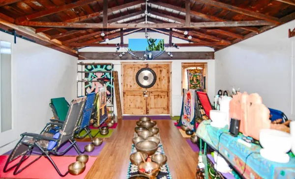 a view of room with wooden floor and windows