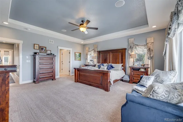 a spacious bathroom with a granite countertop sink mirror and a shower