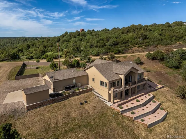 a aerial view of a house with a yard
