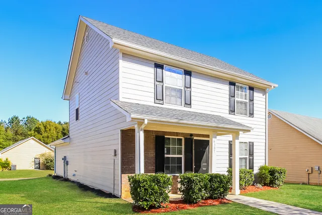 front view of a house with a yard