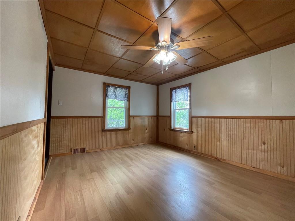 158 Eagle Mill Road Butler, PA 16001 - Photo 12 of 29 an empty room with wooden floor and windows