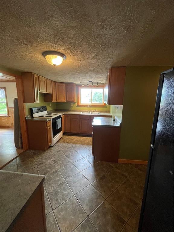 158 Eagle Mill Road Butler, PA 16001 - Photo 17 of 29 a large kitchen with stainless steel appliances a sink a stove and a microwave