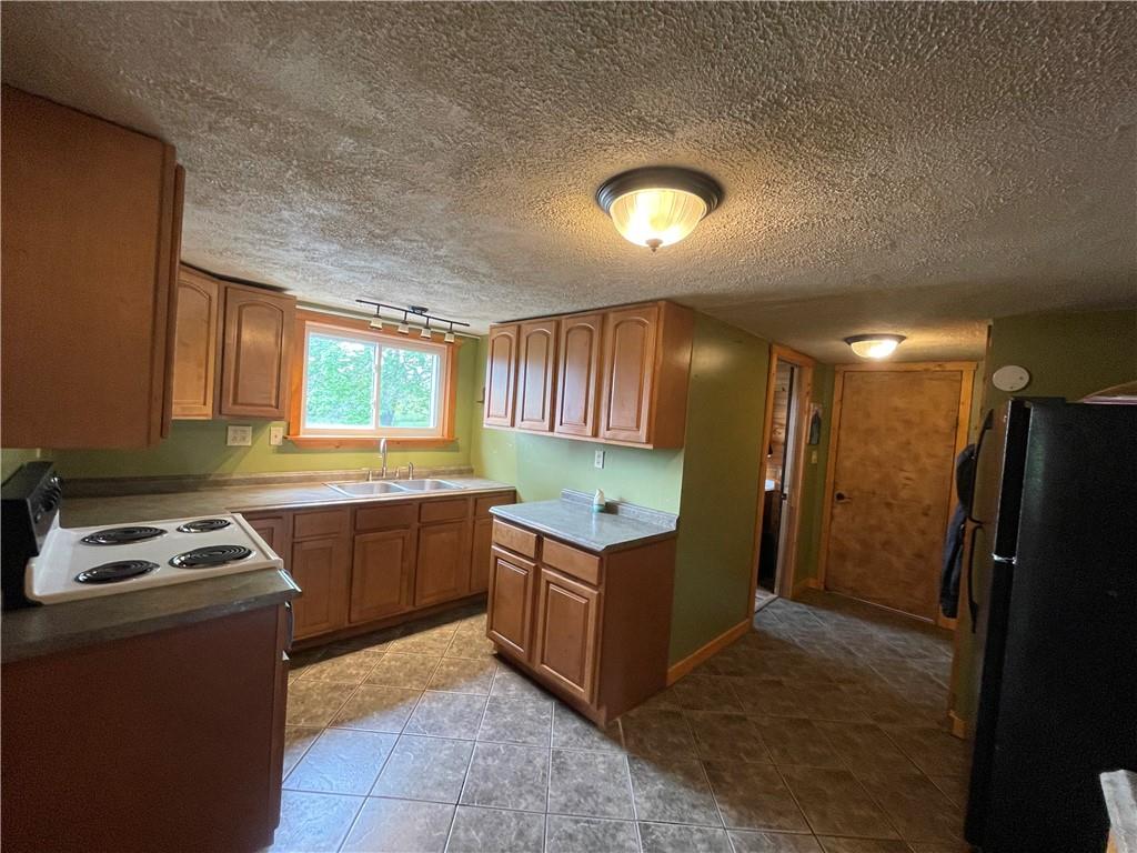 158 Eagle Mill Road Butler, PA 16001 - Photo 18 of 29 a kitchen with a cabinets and a stove top oven