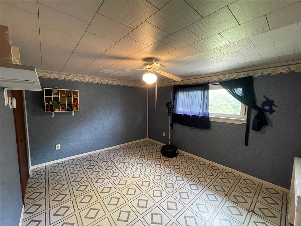 158 Eagle Mill Road Butler, PA 16001 - Photo 26 of 29 a bedroom with a bed and a chandelier