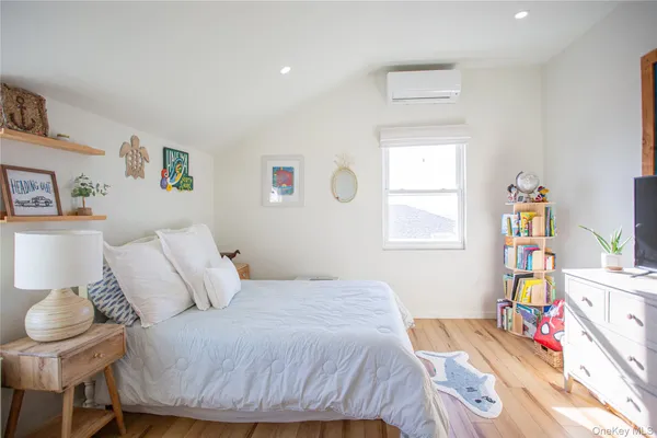 a bedroom with a bed and a table in it