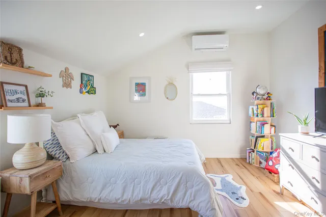 a bedroom with a bed and a table in it