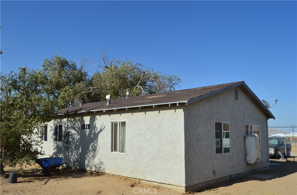 12065 Aztec Lane Adelanto, CA 92301 - Photo 11 of 64 a view of a house with a tree