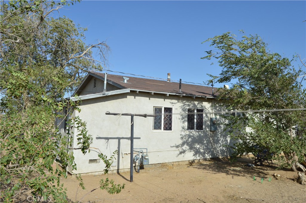 12065 Aztec Lane Adelanto, CA 92301 - Photo 13 of 64 front view of a house with a yard