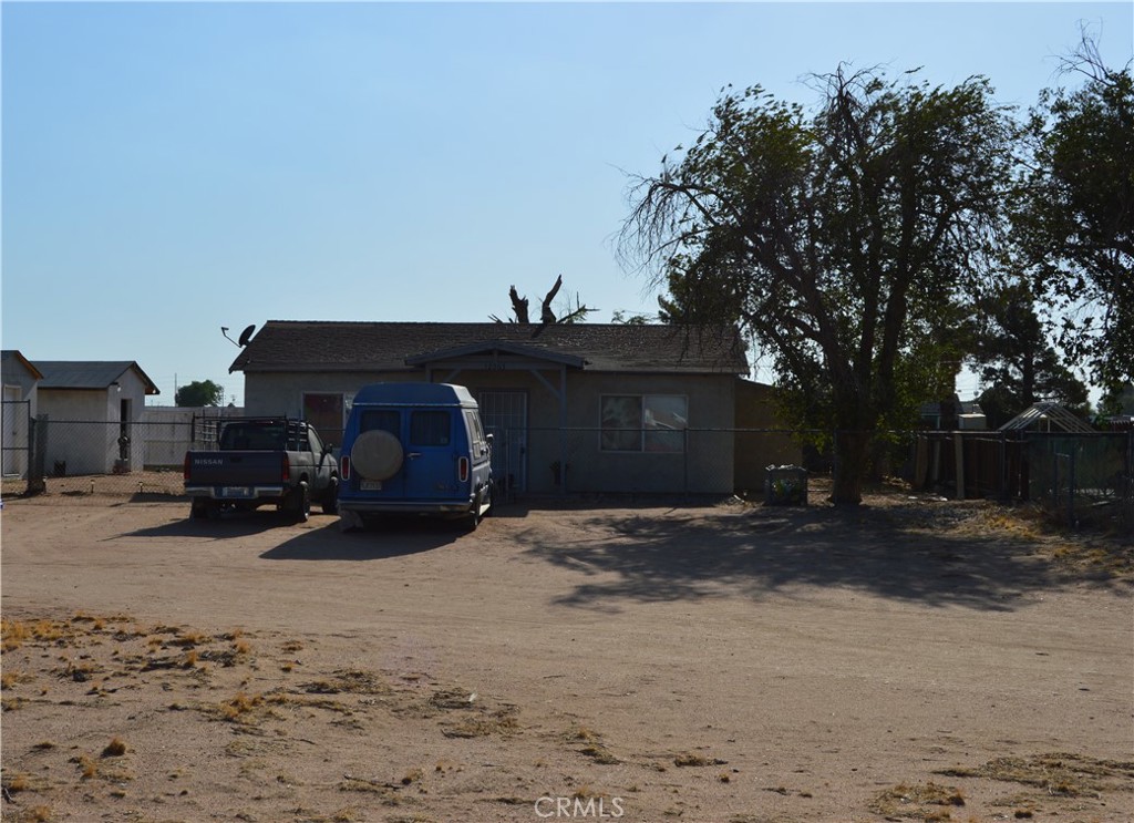 12065 Aztec Lane Adelanto, CA 92301 - Photo 17 of 64 a car parked in front of house