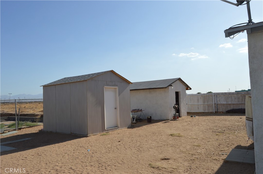 12065 Aztec Lane Adelanto, CA 92301 - Photo 21 of 64 a view of a backyard of a house