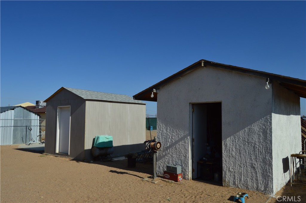 12065 Aztec Lane Adelanto, CA 92301 - Photo 25 of 64 a front view of a house with garden