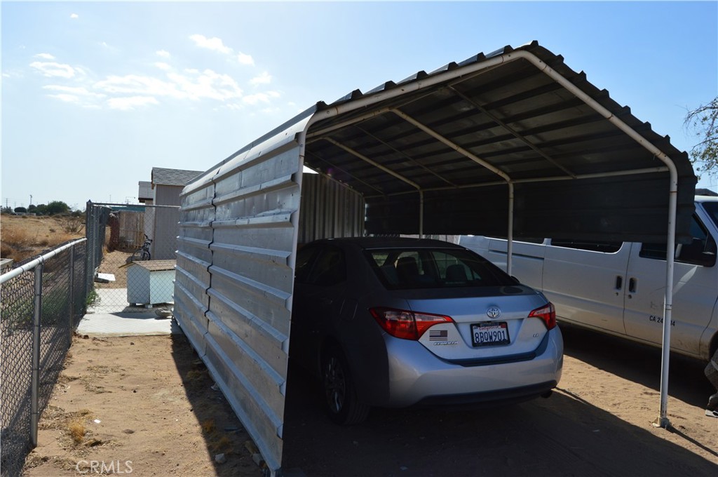 12065 Aztec Lane Adelanto, CA 92301 - Photo 27 of 64 a car parked in front of a house