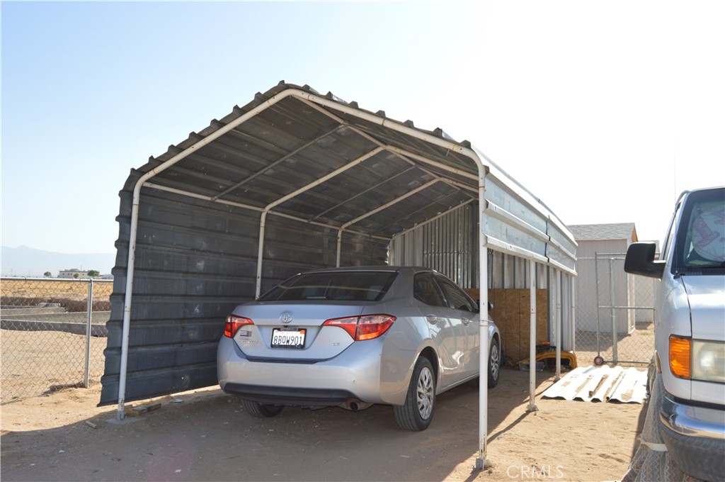 12065 Aztec Lane Adelanto, CA 92301 - Photo 28 of 64 a car parked in front of a building