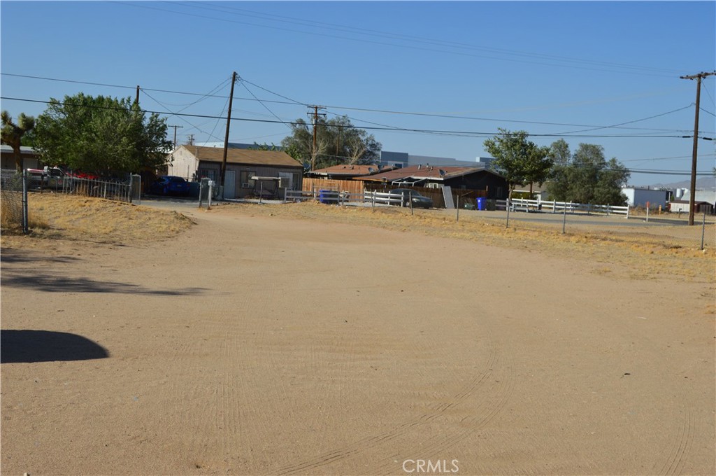 12065 Aztec Lane Adelanto, CA 92301 - Photo 31 of 64 a view of a lake with a building in the background