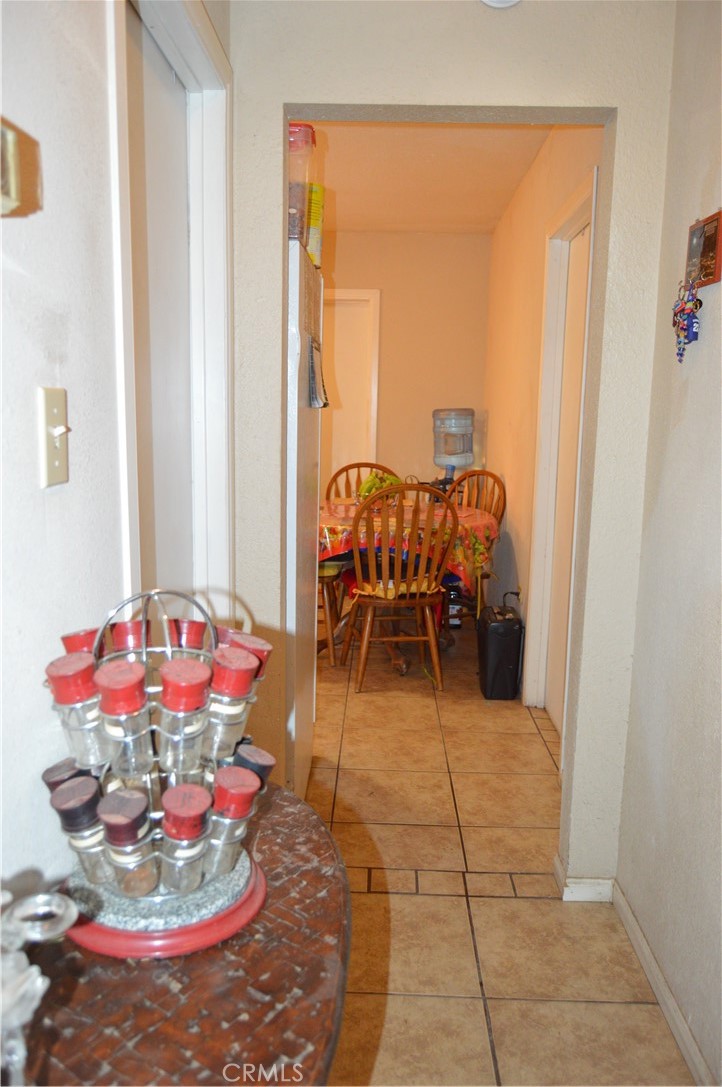 12065 Aztec Lane Adelanto, CA 92301 - Photo 37 of 64 a dining room with furniture and natural light