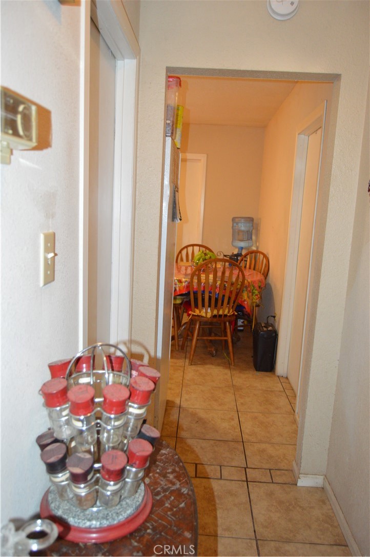 12065 Aztec Lane Adelanto, CA 92301 - Photo 38 of 64 a room with furniture and a potted plant